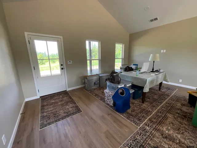 a living room with furniture window and wooden floor