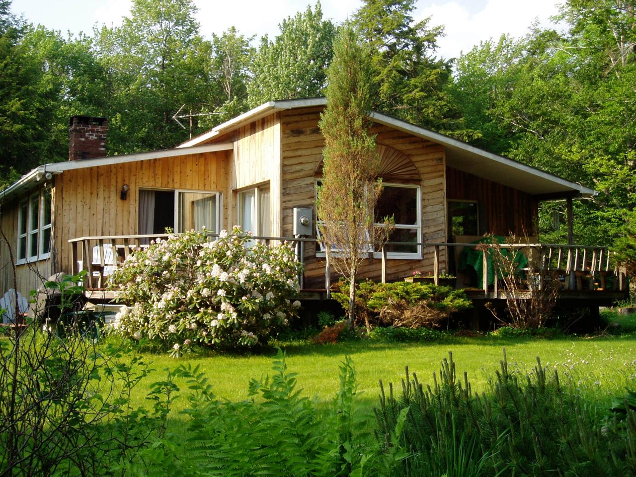 809 Leonhardt Road Becket, MA 01223 - Photo 1 of 8 a view of a house with backyard and garden