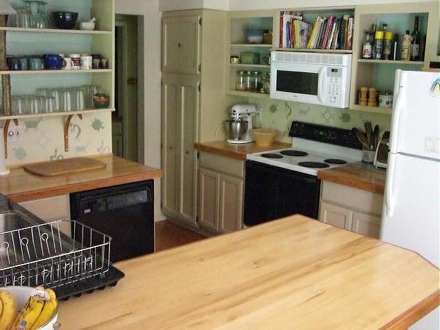 809 Leonhardt Road Becket, MA 01223 - Photo 3 of 8 a kitchen with a stove and a refrigerator