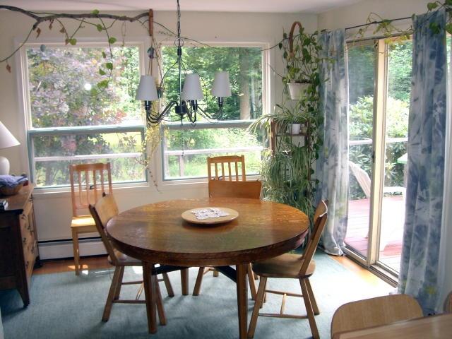 809 Leonhardt Road Becket, MA 01223 - Photo 4 of 8 a view of a dining room with furniture window and outside view