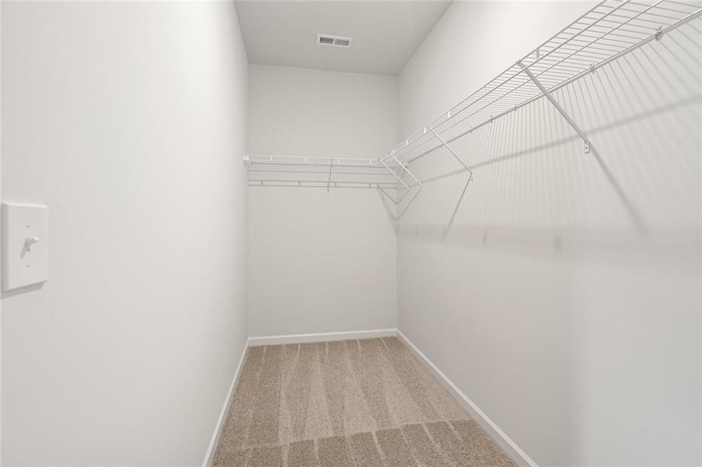 169 Andros Loop Dalton, GA 30721 - Photo 22 of 38 a view of a room with racks on the wall