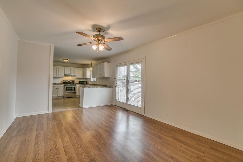 3032 Anderson Road Nashville, TN 37217 - Photo 7 of 17 a view of a kitchen with a sink wooden floor and a window
