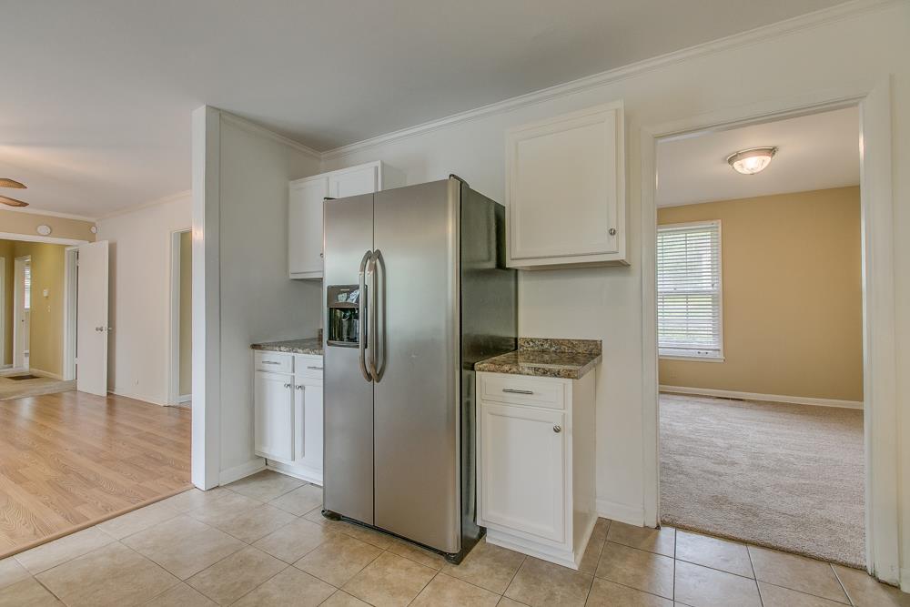 3032 Anderson Road Nashville, TN 37217 - Photo 10 of 17 a kitchen with stainless steel appliances granite countertop a refrigerator and a stove