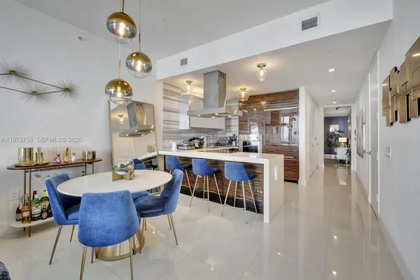 a very nice looking dining room with a table and chairs