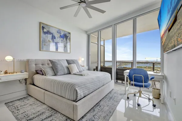 a large bathroom with a glass door shower and sink