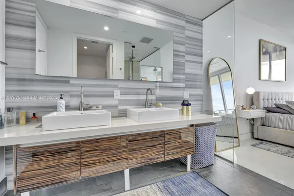 a kitchen with stainless steel appliances a sink and cabinets