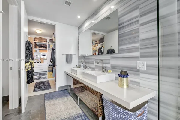 a white toilet sitting next to a shower curtain
