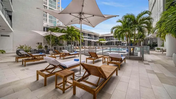 a view of a swimming pool with chairs