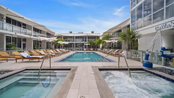 a view of a balcony with yard