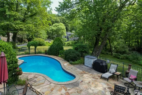 a view of swimming pool from a lounge chair
