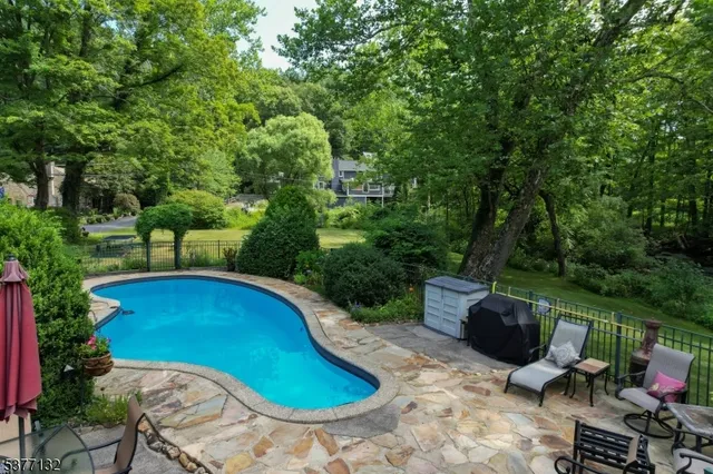 a view of swimming pool from a lounge chair