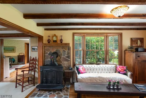 a bedroom with furniture and a fireplace