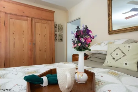 a living room with furniture and flowers