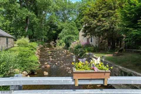 a wooden bench sitting in a yard