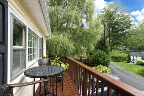 a view from a balcony with furniture