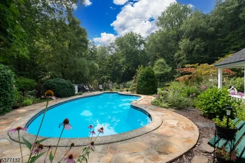 a view of a swimming pool with an outdoor seating
