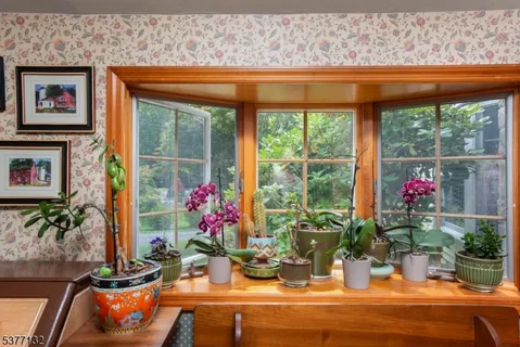 a dining room with a table and chairs