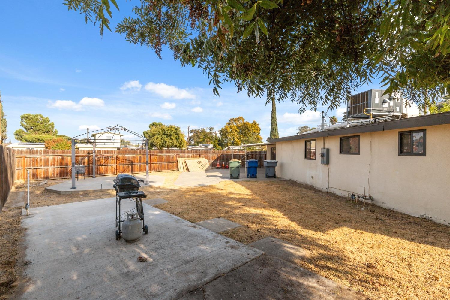 345 Gettysburg Clovis, CA 93612 - Photo 24 of 25 a view of a street with a tree