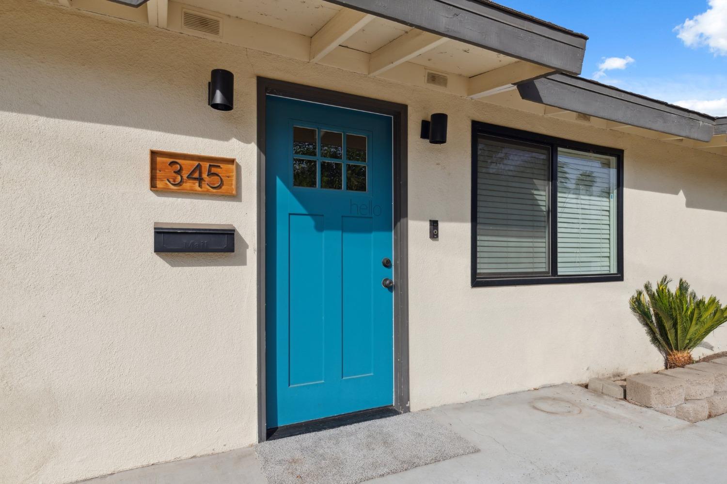 345 Gettysburg Clovis, CA 93612 - Photo 4 of 25 a view of a door and garage