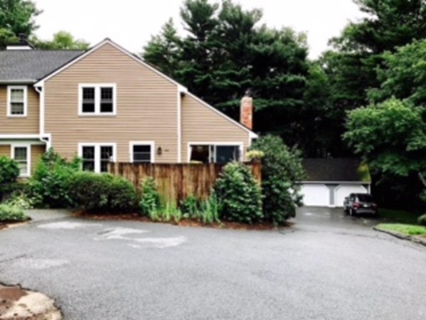134 Russet Lane, Unit 134 Boxborough, MA 01719 - Photo 1 of 16 a view of a house with a yard and plants
