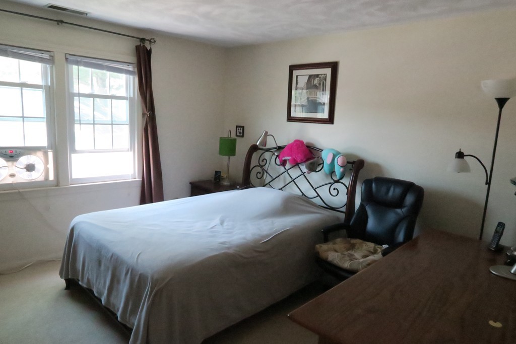 134 Russet Lane, Unit 134 Boxborough, MA 01719 - Photo 12 of 16 a bedroom with a bed and a window