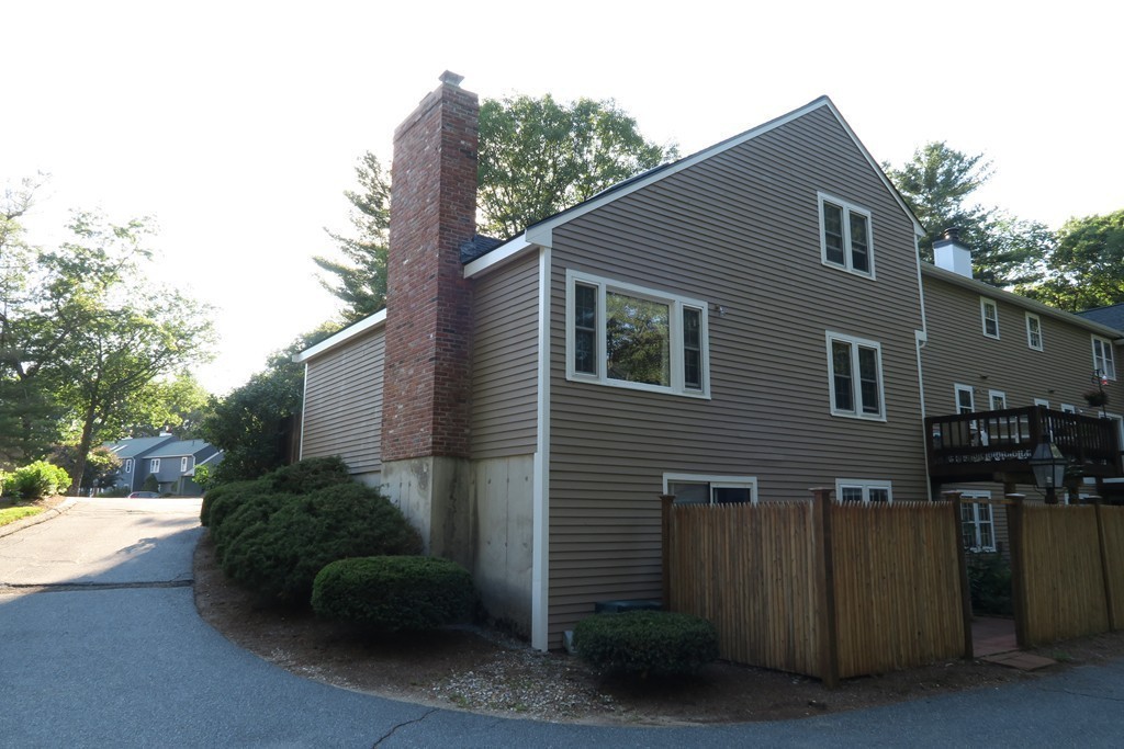 134 Russet Lane, Unit 134 Boxborough, MA 01719 - Photo 14 of 16 a view of a house with a yard