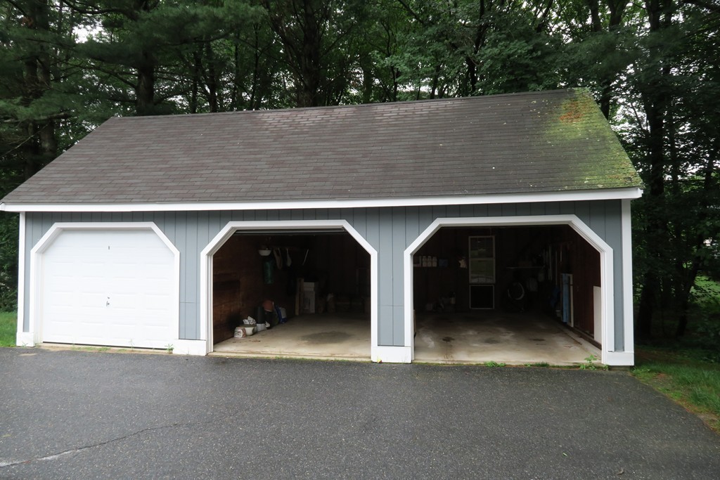 134 Russet Lane, Unit 134 Boxborough, MA 01719 - Photo 15 of 16 an outdoor view of house and garage