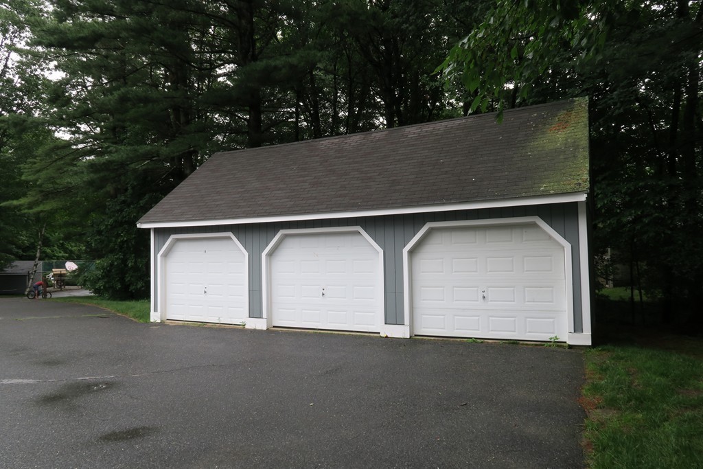 134 Russet Lane, Unit 134 Boxborough, MA 01719 - Photo 16 of 16 a view of outdoor space garage and yard