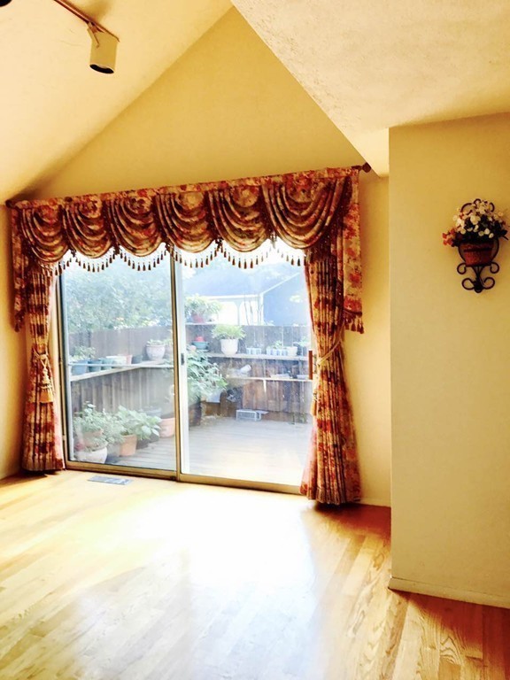 134 Russet Lane, Unit 134 Boxborough, MA 01719 - Photo 6 of 16 a view of a room with a flat screen tv