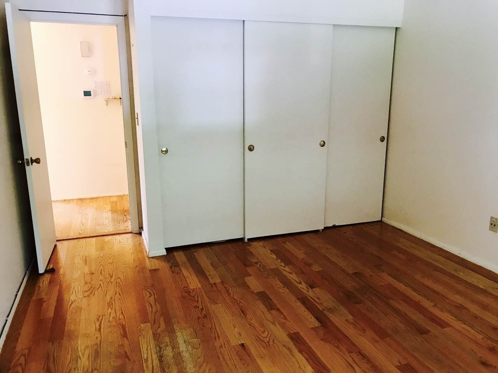 134 Russet Lane, Unit 134 Boxborough, MA 01719 - Photo 7 of 16 a view of a room with wooden floor