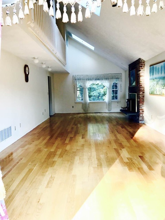 134 Russet Lane, Unit 134 Boxborough, MA 01719 - Photo 10 of 16 a view of a livingroom with furniture and window