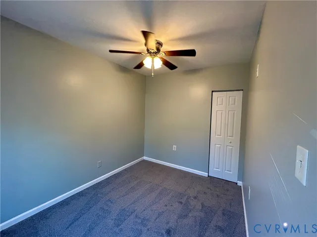 a view of a hallway with windows
