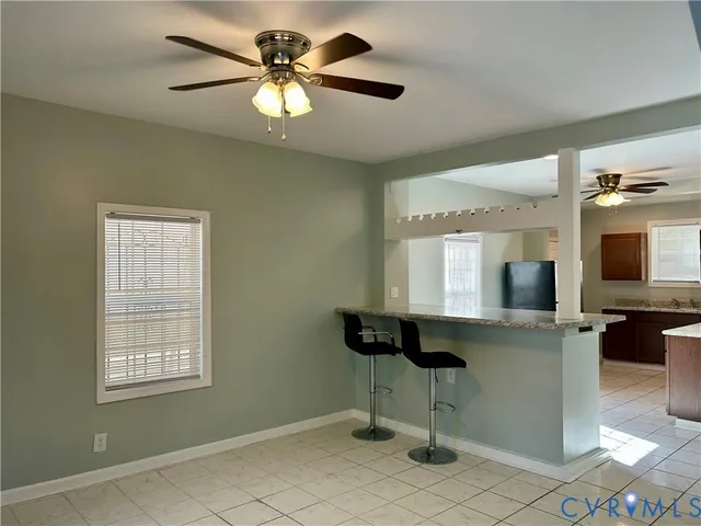 a view of workspace with a window and a chandelier