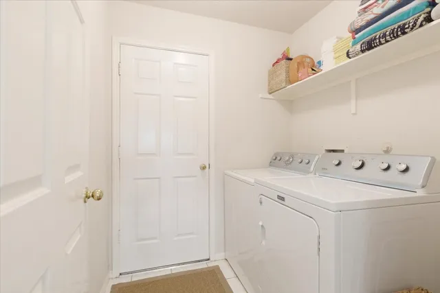 a utility room with dryer and washer