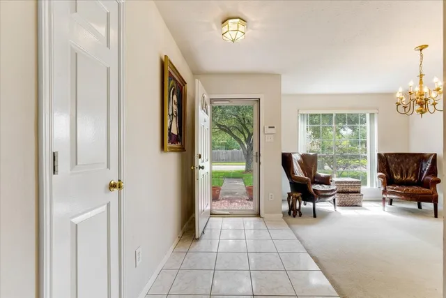 a view of living room filled with furniture and a window