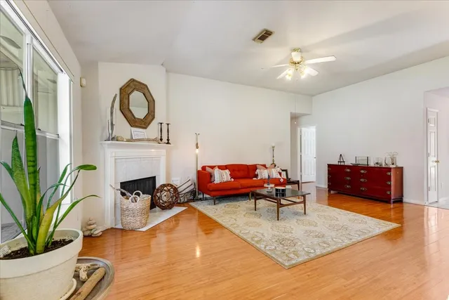 a living room with furniture and a fireplace