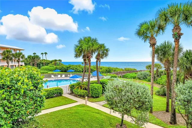 a view of a garden with a lake