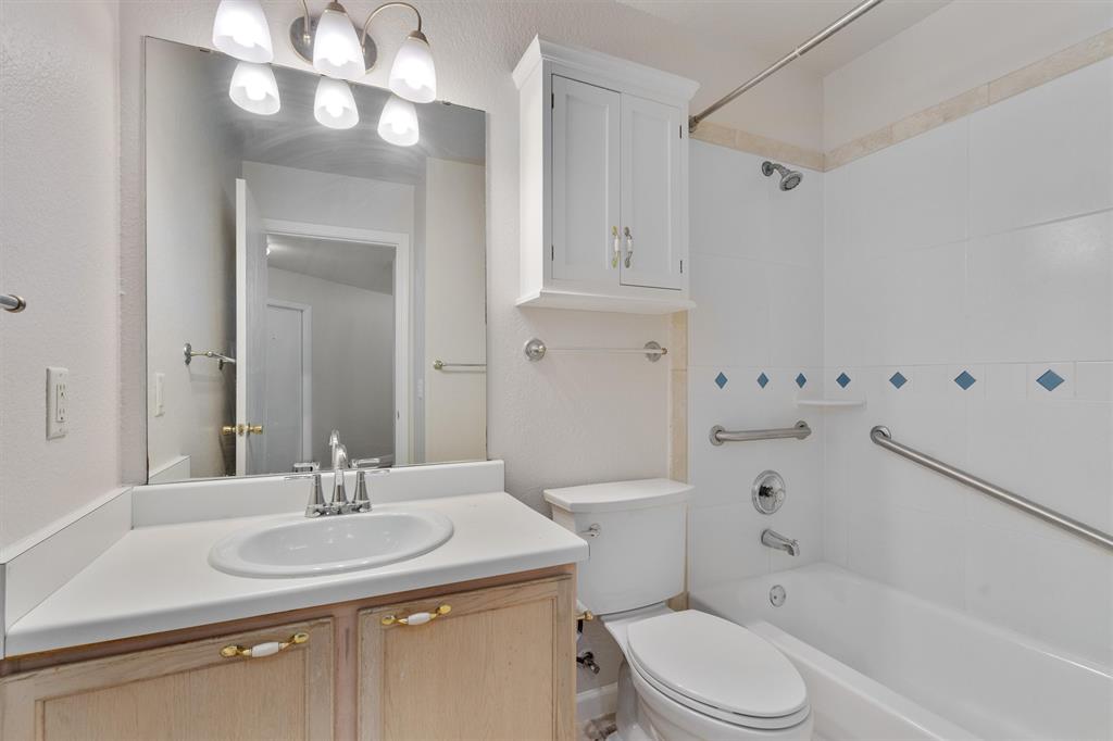 902 Rocking Spur Cove Pflugerville, TX 78660 - Photo 16 of 21 a bathroom with a sink a toilet and shower