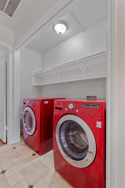 902 Rocking Spur Cove Pflugerville, TX 78660 - Photo 17 of 21 a utility room with dryer and washer