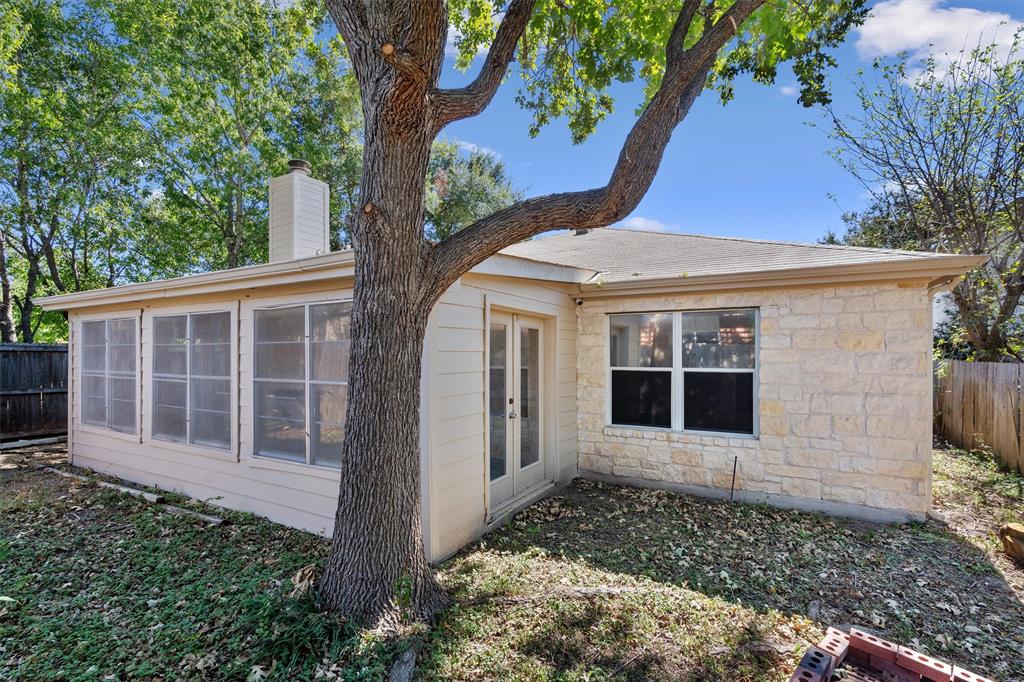 902 Rocking Spur Cove Pflugerville, TX 78660 - Photo 18 of 21 a house with trees in front of it