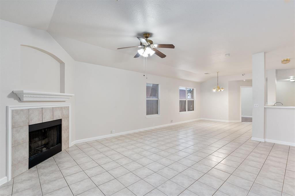 902 Rocking Spur Cove Pflugerville, TX 78660 - Photo 3 of 21 a view of an empty room with chandelier fan and fire place