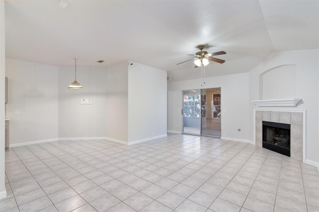 902 Rocking Spur Cove Pflugerville, TX 78660 - Photo 4 of 21 a view of an empty room with fan and kitchen view