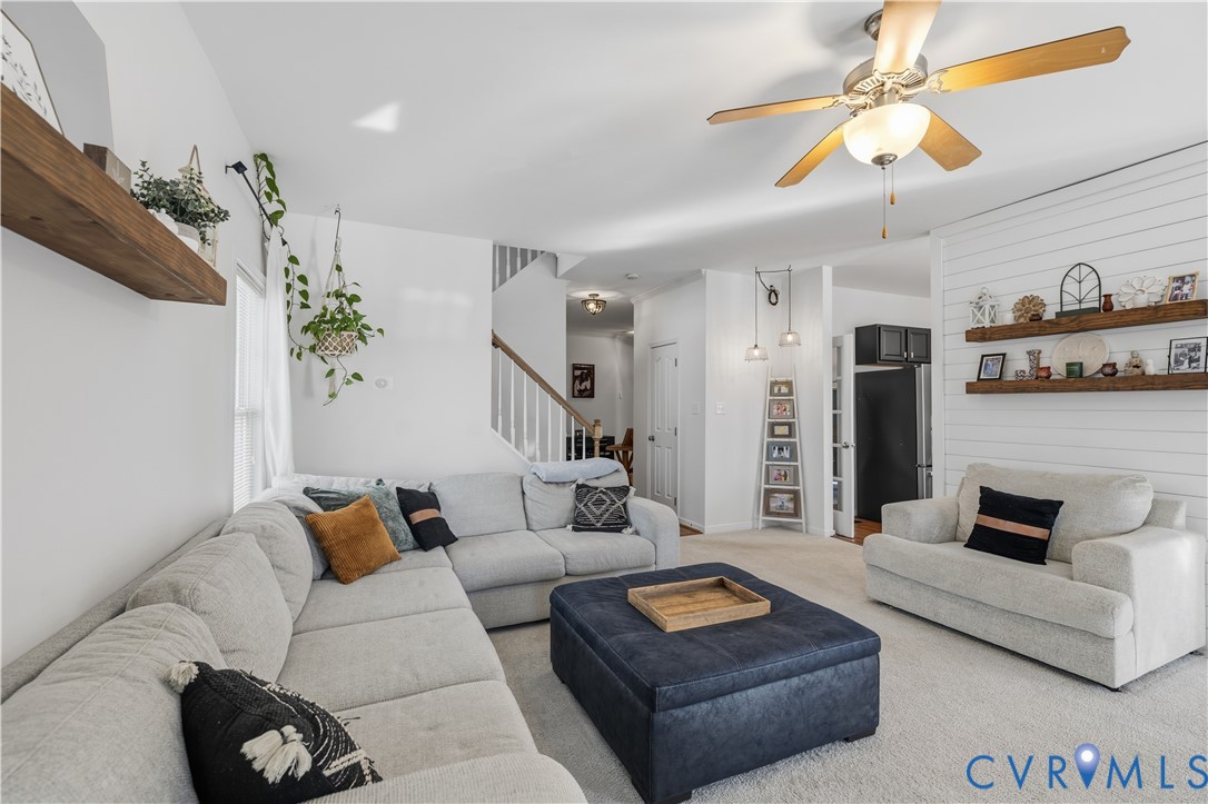 940 Gorham Court Midlothian, VA 23114 - Photo 14 of 45 a living room with furniture and a chandelier