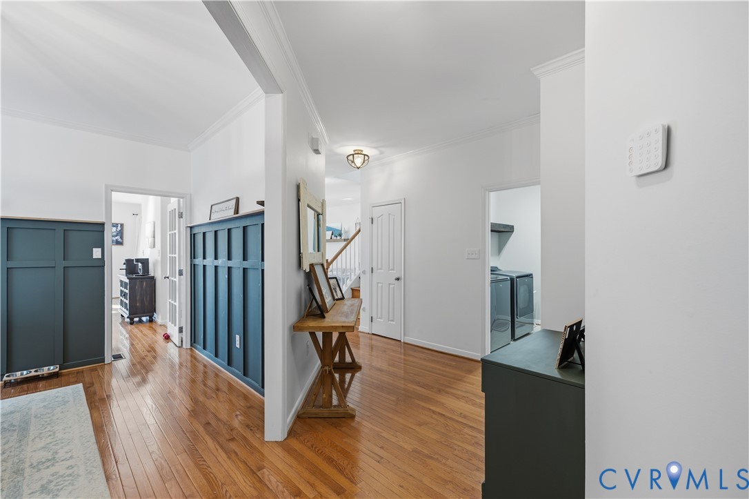940 Gorham Court Midlothian, VA 23114 - Photo 17 of 45 a view of a hallway with wooden floor and stairs