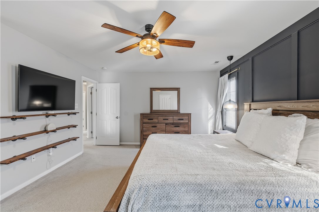 940 Gorham Court Midlothian, VA 23114 - Photo 23 of 45 a bedroom with a bed and a flat screen tv