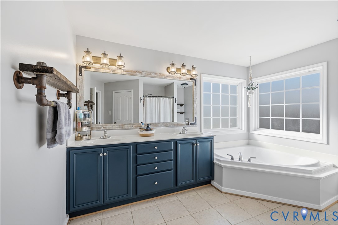940 Gorham Court Midlothian, VA 23114 - Photo 25 of 45 a bathroom with a tub sink and mirror