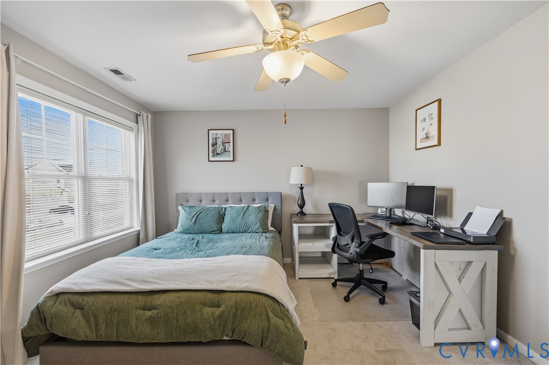 940 Gorham Court Midlothian, VA 23114 - Photo 29 of 45 a bedroom with a bed gym equipment and a window