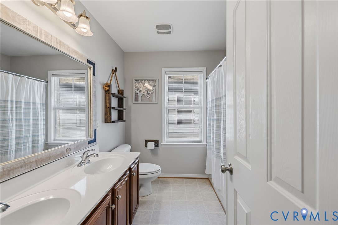 940 Gorham Court Midlothian, VA 23114 - Photo 30 of 45 a bathroom with a sink a toilet and shower