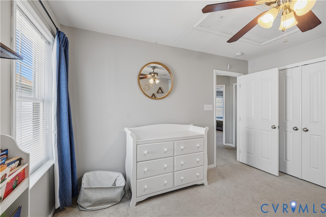 940 Gorham Court Midlothian, VA 23114 - Photo 32 of 45 a bedroom with a chair and a chandelier