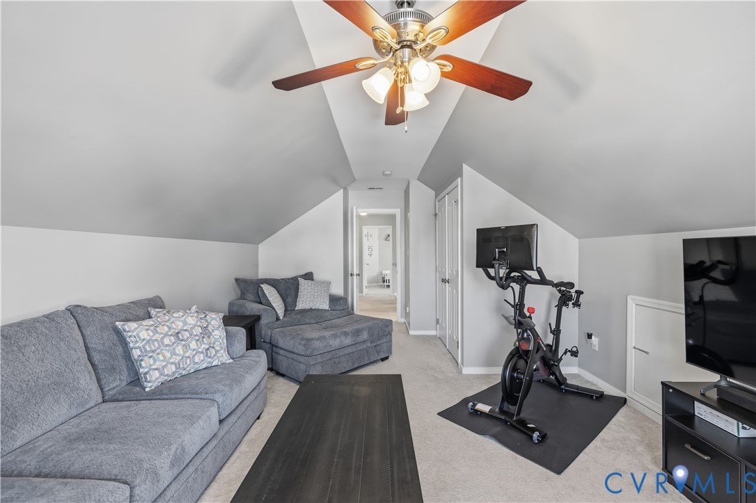 940 Gorham Court Midlothian, VA 23114 - Photo 36 of 45 a living room with furniture a flat screen tv and a window